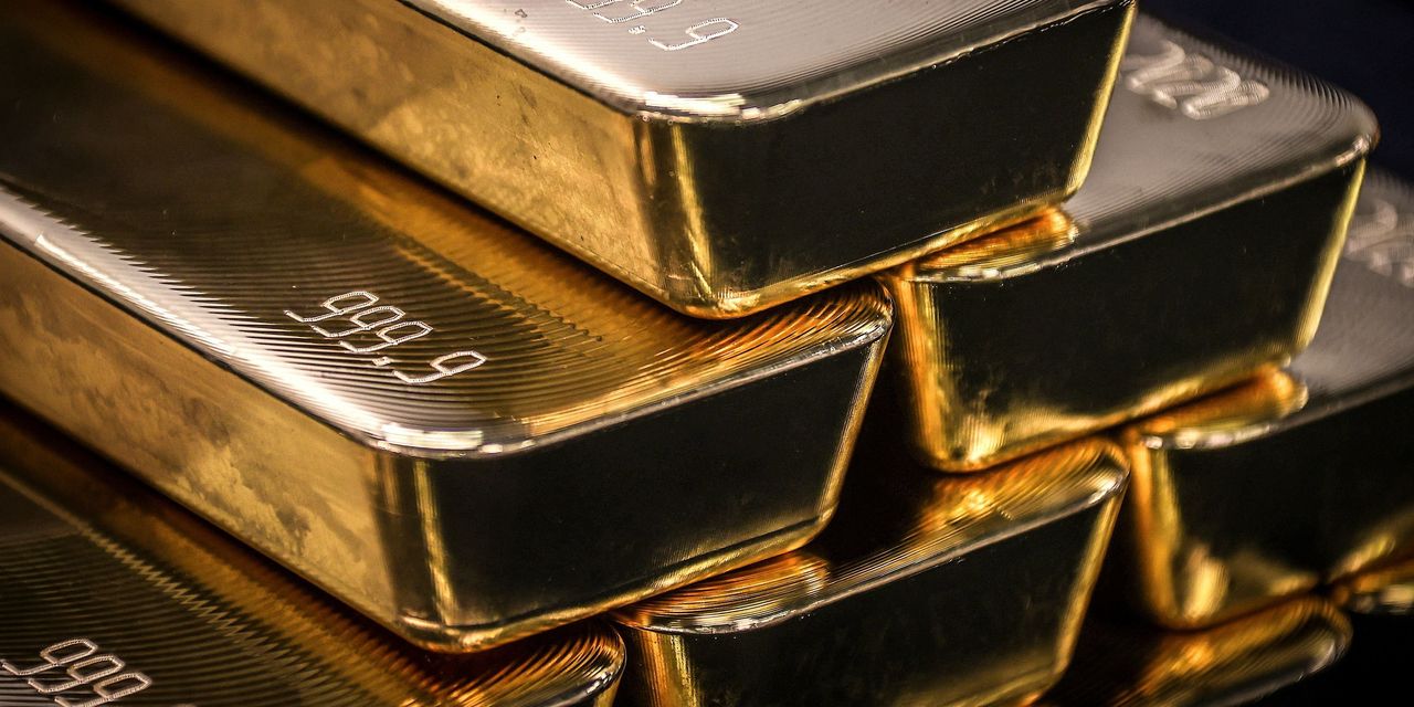 Gold falls to lowest in more than 2 years as dollar, yields soar