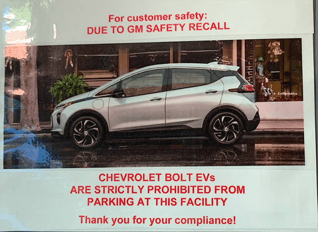 Image of sign prohibiting Chevy Bolt EV from parking due to safety recall